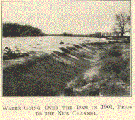 WATER GOING OVER THE DAM IN 1902, PRIOR TO THE
NEW CHANNEL.