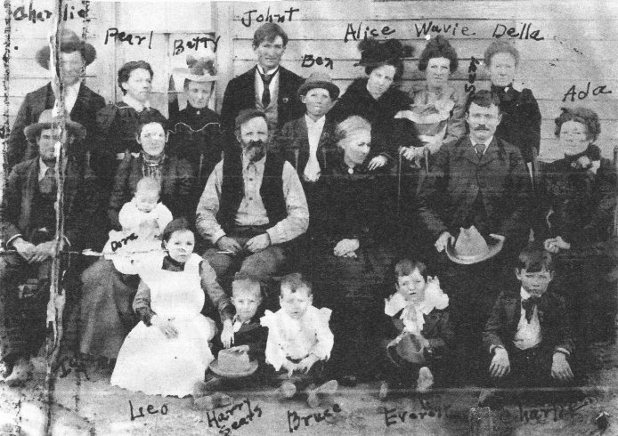 The Family of Green and Roseanna Helton Adams, circa 1900.

Back: Charlie Adams, Pearl Frame Adams, Betty Adams Scott, Johnathan Adams, Ben Adams, Alice Adams Ward, Wavie Adams Lacy, Della Adams Shutltz.

Middle: Morgan Adams, Ivy Bell Adams with child Dora Adams, Green Adams (son of Rev. J.M. 'Bud' Adams), wife Roseanna Helton (dau. of A.J. & Delphia Wireman Helton), Sam Shultz, Ada Adams Ward.

Front: Leo Adams (later m. Jack Ryckman), Harry Sears (son of Betty), Bruce Adams, Everett Shultz and Charlie Shultz (sons of Della).

Photo from the collection of Kim Fowles.