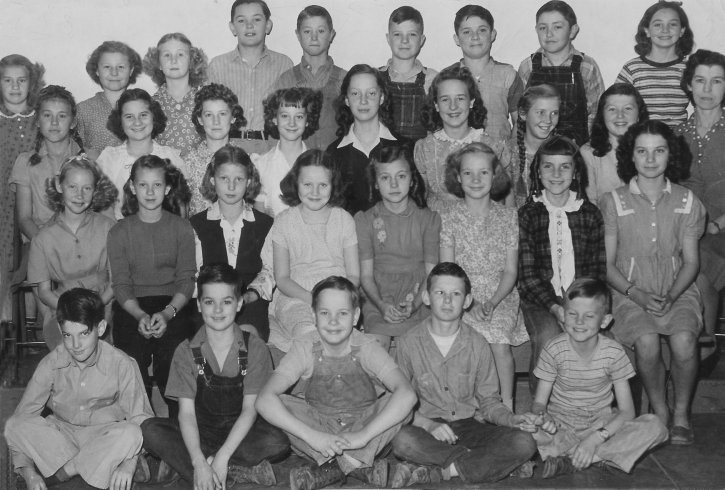 Sun City School, Barber County, Kansas, 1946-1947.

4th row (top) - Elizabeth (Keller) Goodnight, Martha Sloan, Virginia Walker, Glenn Hamilton, Wesley Bennett, Marion Lee Freeman, Floyd Statts, Kendall Quimby, Wanda Hamilton. 

3rd row - Blythe (Collins) Cramer, Betty Brown, Wanda Walker, Otilia (Hamilton) Garten, Melba Jarnigan, Velma Davis, Barbara Cobble, Judy Howard, Mable Minor (teacher).

2nd row - Myrna Henson, Naomi Hentis, Mary Ann Fittro, Janet (Knowles) Boggs, Lois Freeman,
Bobbie (Houchin) Freeman, Marilyn Davis, Faye Troutman.

1st row - Duane Joseph, Billy Johnston, Dean Houchin, Ray Troutman, Bobby Payne.

Photo courtesy of Marilyn (Collins) Cramer.