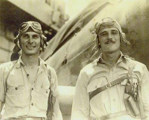 Lt. Howard Reason Burnett (with moustache), USN, World War II, stands at right in this photo of him with his gunner. Photo courtesy of Addie Ellen (Burnett) Thomison.