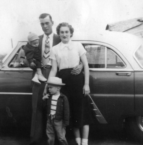 Wendel and Alice Ferrin with their first two sons, Darrell & Jerry, about December 1952, Comanche County, Kansas.