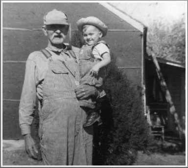 'Uncle' Tom Hosford holding Darrell Ferrin at the Norton's house in Protection, Kansas, about 1953. Photo from the collection of Alice (Norton) Ferrin.