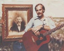 Jerry Ferrin,  at a 1984 Ferrin family reunion at Buck Ferrin's house in Comanche County, Kansas, poses with a photo of his great grandfather, Loren Ferrin. Polaroid photo by Wendel Ferrin, 1984.
