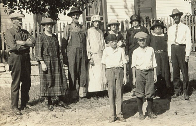 Family reunion at the Jordan farm, Comanche County, Kansas, 1925: Front row: Burton Lyons, Clifford Lyons.  Back row,left to right: Zue McFerren, Martha Baker McFerren, Hiram Jordan, Fidelia Jordan, Hazel Lyons and three unidentified people. Photo courtesy of Connie Chancellor.