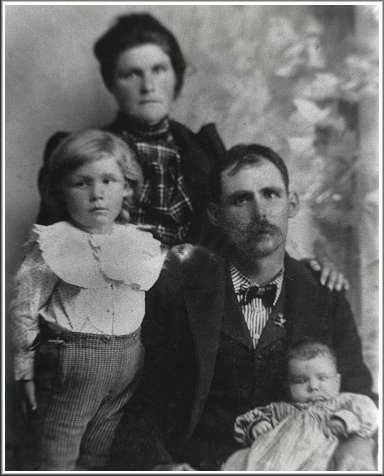 Charles William Norton & Lettie Ann (Grimes) Norton with their sons, Robert Emmett Norton (standing) and Wesley Roy Norton. Photo from the collection of Christa (Ashlock) Taylor.