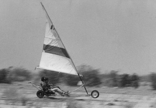 Tim Dardis riding the NPTR Special Services two-seater landsailer at the abandoned Holtville air strip. The other person on the landsailer is either Pat Sweeney or Dick McKie.

Photo by Jerry Ferrin, 1975.