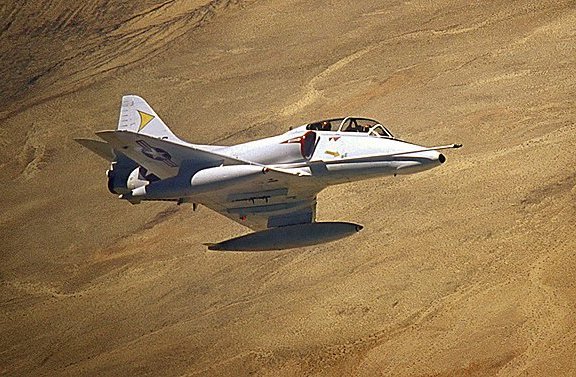 NPTR Skyhawk TA-4J being flown above the desert in Imperial Valley, California, by Lt. Finley with PHAN Richard Blue in the back seat.

Photo courtesy of PH3 Charles 'Chuck' Lohman.