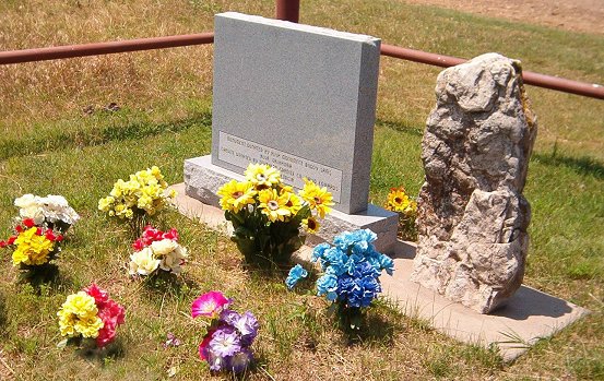 The Cowboy Cemetery near Salt Plains, Woods County, Oklahoma, view of the back of the original gravestone and the memorial tablet.

Photo by Bobbi (Hackney) Huck.