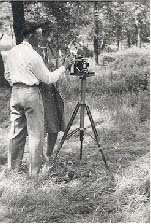 John Edward Schrock taking a photograph.