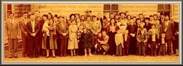 The congregation of the Wilmore Church of Christ, Wilmore, Comanche County, Ks, July 1952. Photo by James Allen Nichols;  from the collection of Wendel Ferrin, who is the tall man in the center of the back row. Weldon Trummel is the second person from the left and 'Slim' Masterson is the 4th man from the left.