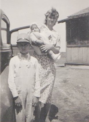 Back:  Gloria Wilson holding Carmen Wilson.
 
Front:  Charles Wilson.
 
Hugoton, Kansas, late 1935 or early 1936.

Photo courtesy of Rhonda (Cline) Nickel.