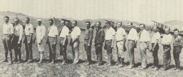 The crew lines up with five Standards at Williamsport, Pennsylvania, in 1927.  

Left to right: Charles (Slim) West, Jack Ashcraft, (unknown), Duke Krantz, Pangborn, Van Gates, (unknown), Samuel (Buck) Steele, (unknown), Mickey Efferson, Al McClatchie, (unknown), George Daws, Eddie Brooks, (unknown), and Shorty Bittner.

News photo courtesy of Jack Ashcraft's great niece, Cindy Weigand.