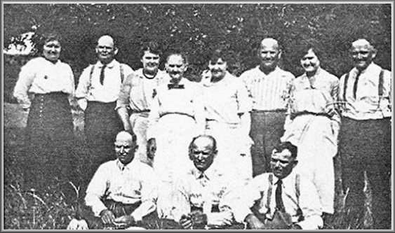 Back row, left to right:
Christina Wood, Joe Booth, Hattie Wood, Christina (Baird) Booth, Mary Murphy, James Booth, Belle Hall,  William Booth. 
Front row, left to right:
Sam Booth, Henry Booth, Robert Booth. 

Photograph from the collection of Teresa Benz.