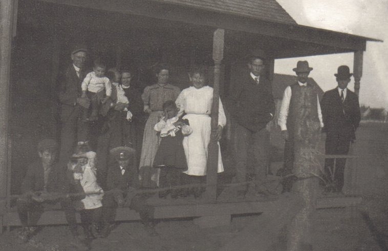 A group of people on a porch, possibly in Comanche County, Kansas.

Photo courtesy of Rhonda (Cline) Nickel.