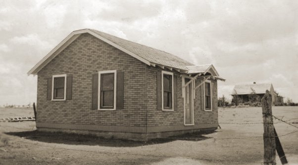 Left to right: J.R. Cline and J.M. Cline homes, 1940s, Coldwater, Kansas. 

Photo courtesy of Rhonda (Cline) Nickel.