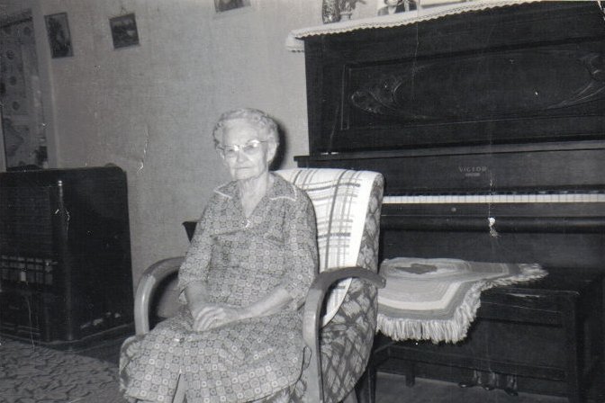 Minerva Cline by the piano in her home, Coldwater, Kansas, circa 1963..

Photo courtesy of Rhonda (Cline) Nickel.