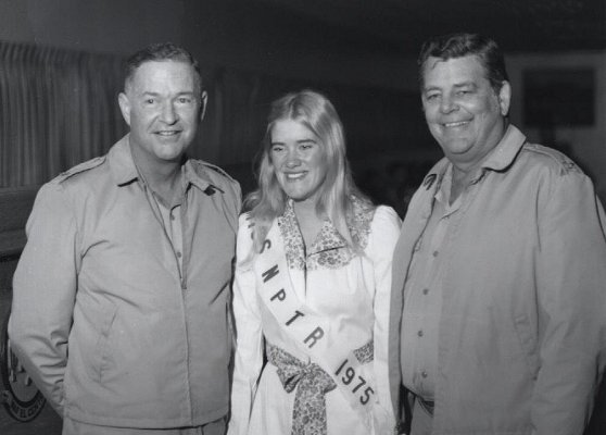 Left to right: Captain Chew, Commanding Officer of the National Parachute Test Range,  Lydia Stevens, Miss NPTR 1975; Captain Paulk, Commanding Officer of NAF El Centro, El Centro, California.

Photo by PHAN Pat 'Smitty' Smith, 1975.

CLICK HERE to view a larger copy of this image in a new browser window.