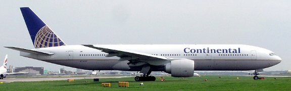 Continental Airlines Boeing 777-224ER (N78017), with engines running, waits for permission to take off at Gatwick Airport, England.

Photo taken by Adrian Pingstone in April 2004 and released to the public domain. Wikimedia Commons.