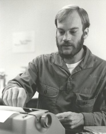 PHAN Jerry Ferrin at work on an article for The Sandpaper, the National Parachute Test Range's base newspaper. Photo by PH3 Dick McKie, circa 1975.