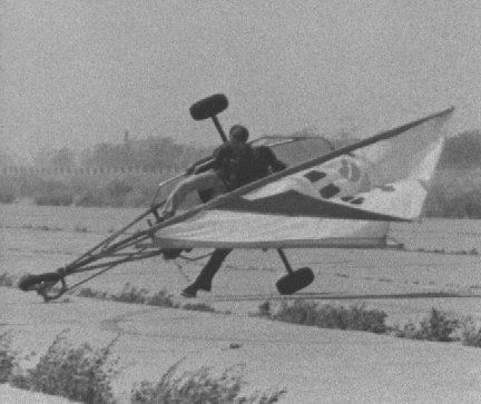 Tim Dardis midway through the tipping over of the NPTR Special Services two-seater land sailer at the abandoned Holtville air strip. The other person on the land sailer is either Pat Sweeney or Dick McKie.

Photo by Jerry Ferrin, 1975.