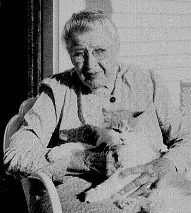 Alcana (Wagner) Ferrin on the front porch of her home in Wilmore, Comanche County, Ks.  Photo by John Edward 'Ed' Schrock