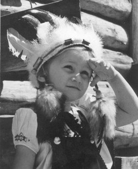 Janet Schrock wearing an Indian head-dress.  Photo copyright John Edward Schrock.