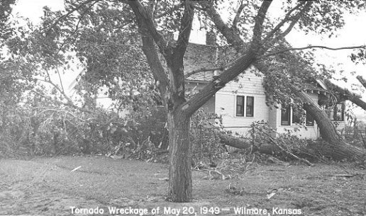 A house damaged by falling trees in the May 20th, 1949 tornado which hit Wilmore, Comanche County, Kansas. Photo by John Edward (Ed) Schrock, used with permission of Janet Schrock Hubbard.