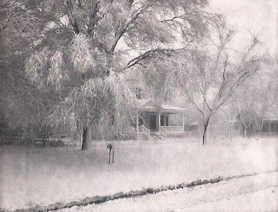 The Walter Smith family residence, at left, on 20 February 1969 after a snowstorm in Wilmore, Kansas. The house, a 'kit home' from Sears and Roebuck, was originally built as the residence of Loren and Alcana Ferrin. At right in the photograph is the house originally built by Harve Schrock. 

Photo courtesy of Nancy Smith.