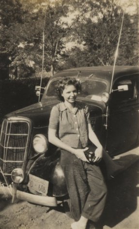 Marie Trummel of Wilmore, Ks, with Wendel Ferrin's car, about 1946.  Photograph by Wendel G. Ferrin.