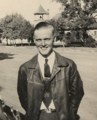  Delmer Lee 'Buck' Ferrin of Wilmore, Ks, spring of 1945. Photograph by Wendel G. Ferrin. The Wilmore Church of Christ, to which Delmer & Wendel and their parents belonged, is in the background.