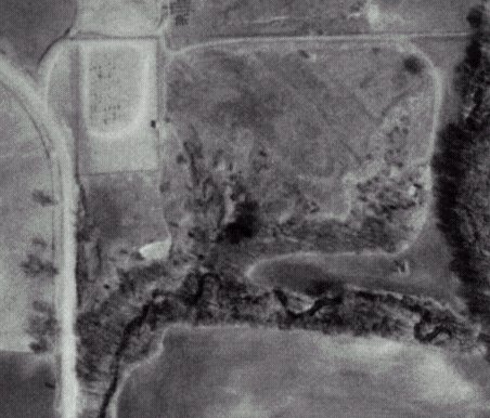 USGS aerial photo of the north end of Wilmore, Kansas. The Wilmore Cemetery is at upper left in the photo. The road to Ira Schultz's cabin described by Wendel Ferrin may be seen passing the northern edge of the cemetery going east and then turning south towards Mule Creek where Ira's cabin stood.