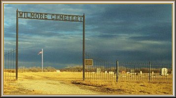 Photograph of the gate at the entrance of the Powell Township Cemetery at Wilmore, Comanche County, Kansas.  Photo courtesy of Bobbi (Hackney) Huck.