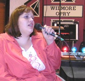 Wendy Monroe of Greensburg, Kansas, sings at the Wilmore Opry.