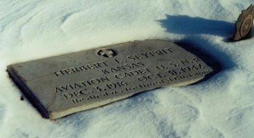 The gravestone of Herbert L. Seyfrit, 3 Dec 1916 to 31 Oct 1942, Aviation Cadet, United States Naval Reserves, Crown Hill Cemetery near Coldwater, Comanche County, Kansas. Photograph by Bobbi (Hackney) Huck.